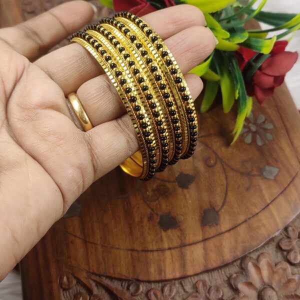 High quality..black beads gold finished bangles...